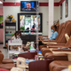 A worker paints a woman’s nails at a nail salon amid the coronavirus pandemic in Austin, Texas on May 8, 2020 following a slow reopening of the Texas economy.